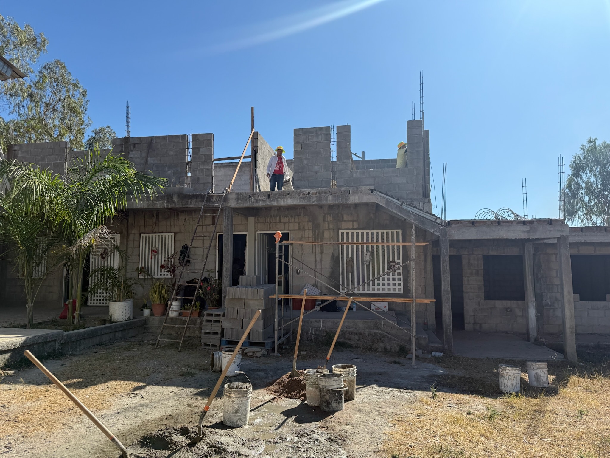 Construction workers building a home structure in Honduras