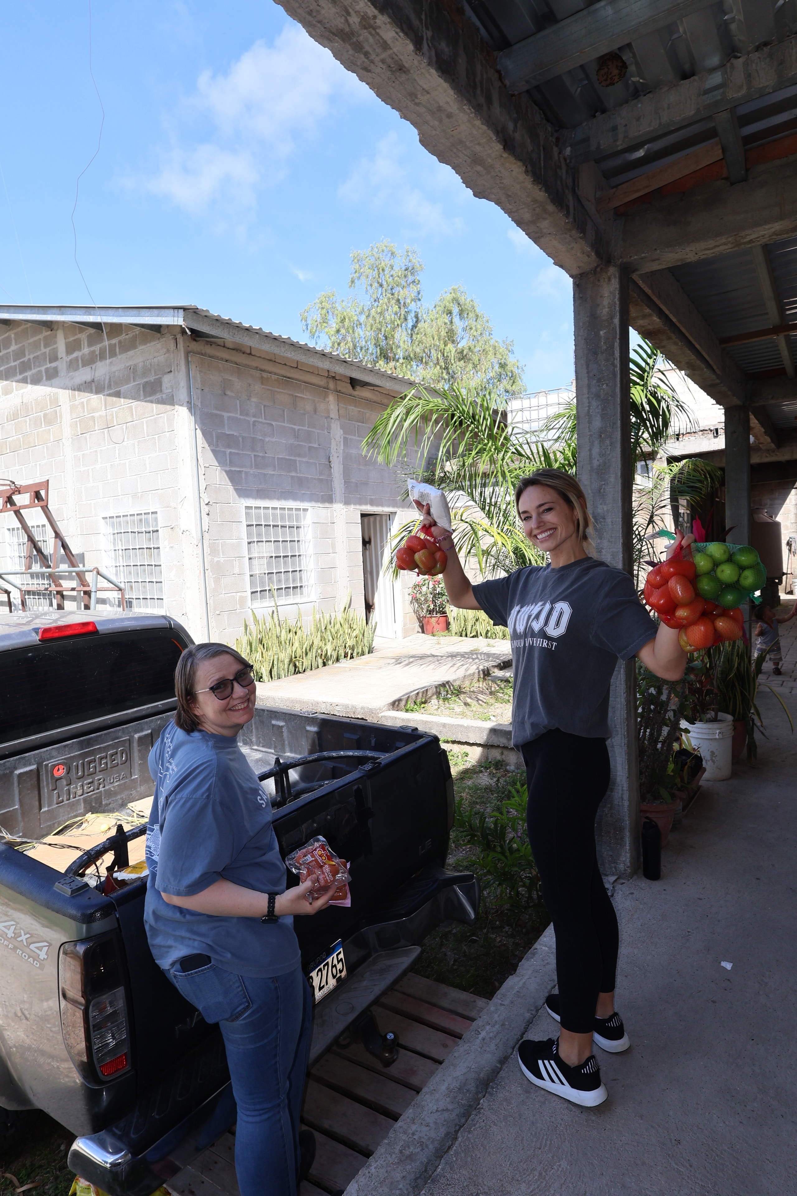 Volunteers unloading fresh produce for families in Honduras