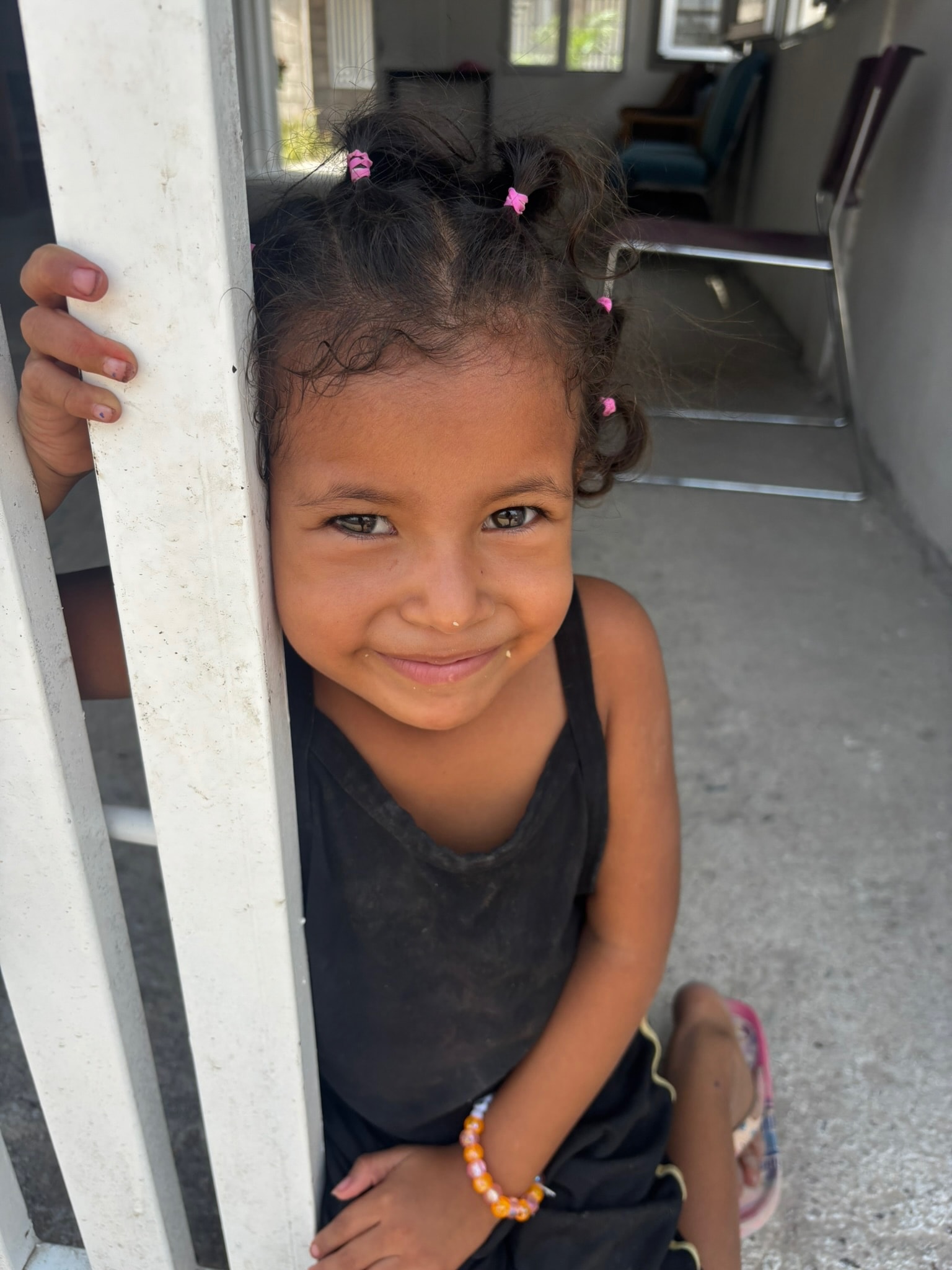 Young girl smiling — a child supported by Dear Rubi Foundation