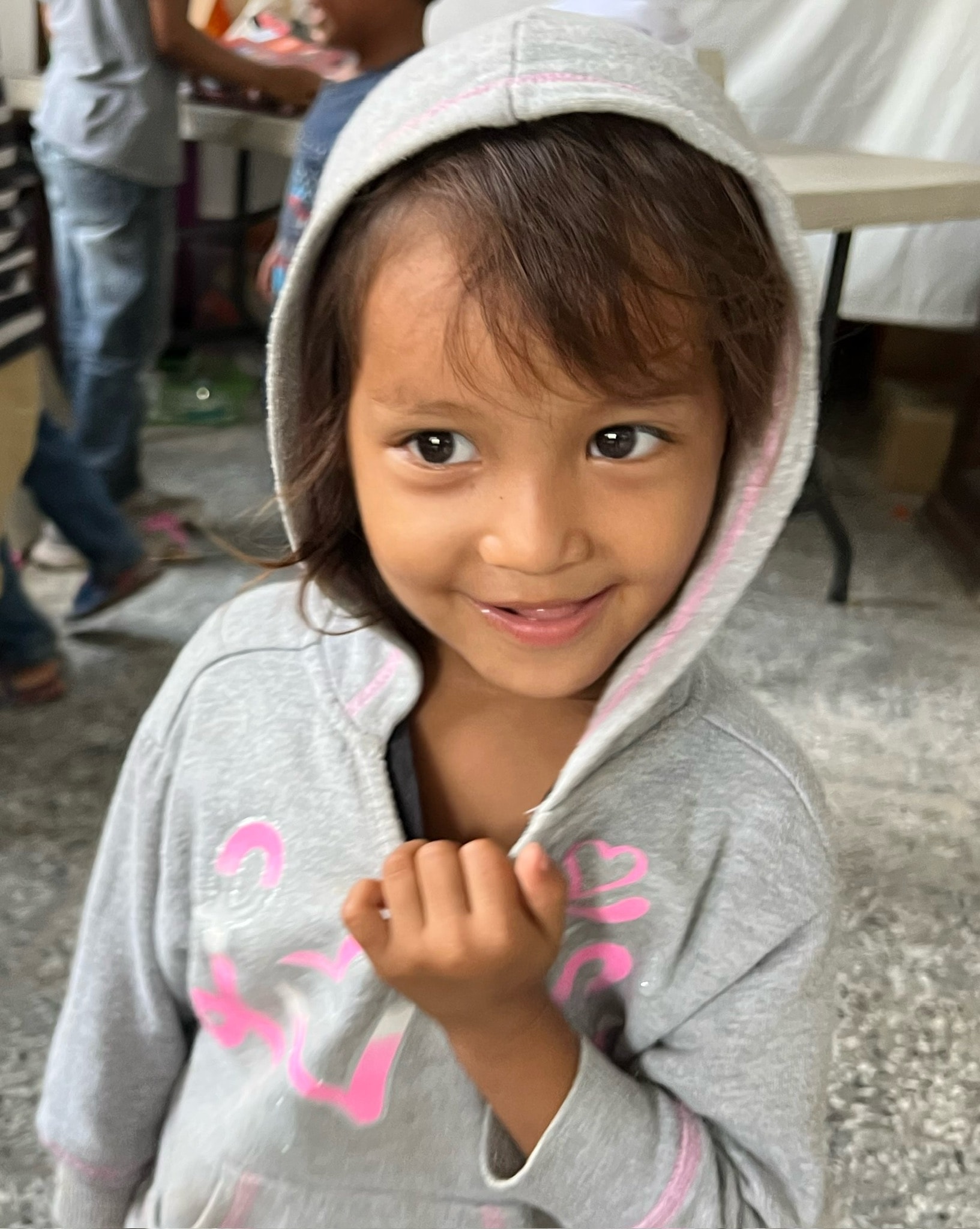 Young girl smiling — a child in the Dear Rubi community